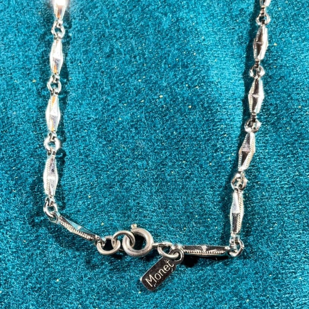 Vintage Monet 28” silver tone necklace.  Mint condition.  Unique links.